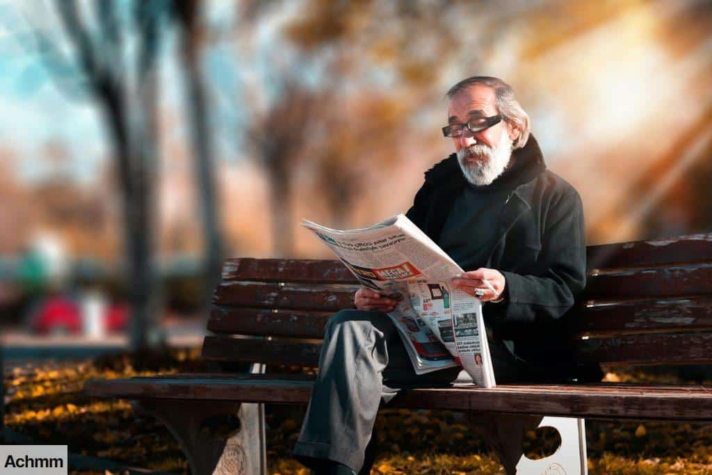 Photo of Man Reading Newspaper